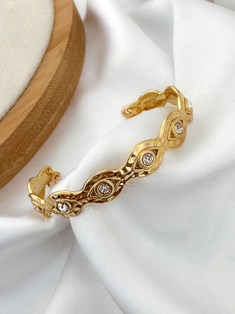 bracelete banhado a 10 milésimos e verniz italiano designer olho grego com ponto de luz.