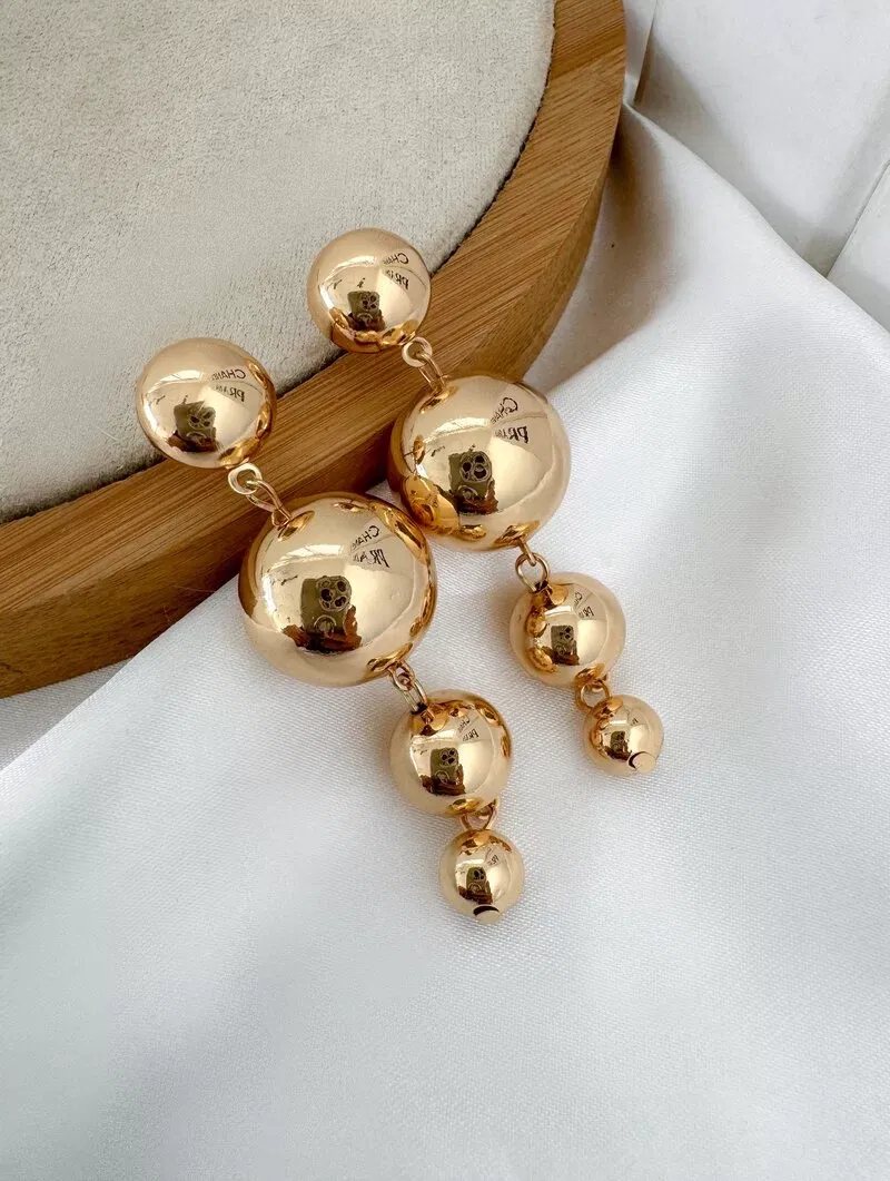 Brinco Folheado a Ouro 18k e Prata Quatro Esferas Lisas