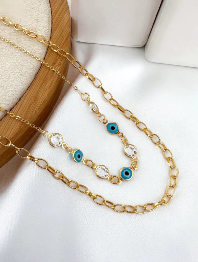 Colar duplo cristais e olho grego folheado a ouro 18k.