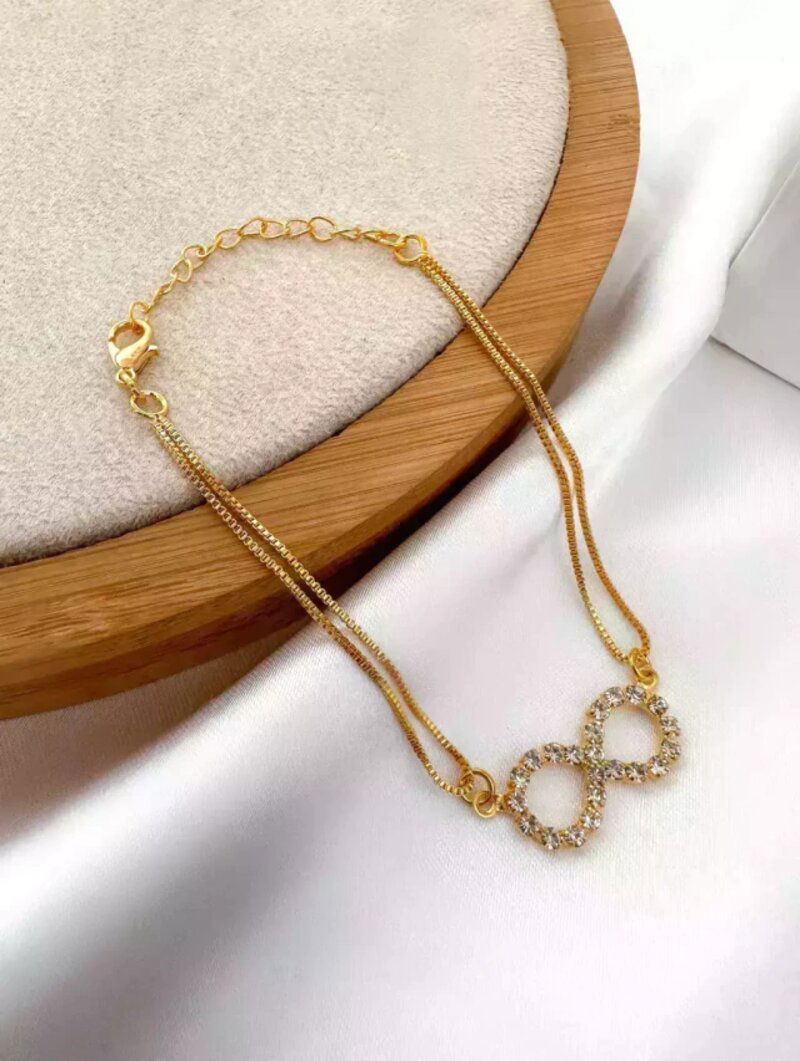 Pulseira dupla folheado a ouro 18k com símbolo do infinito de zircônias.