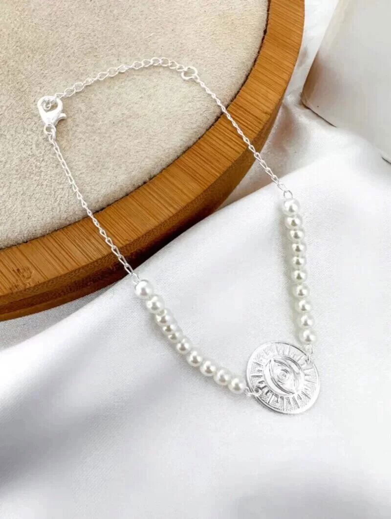 Pulseira folheada a ouro 18k e prata 925 de perola com olho grego.
