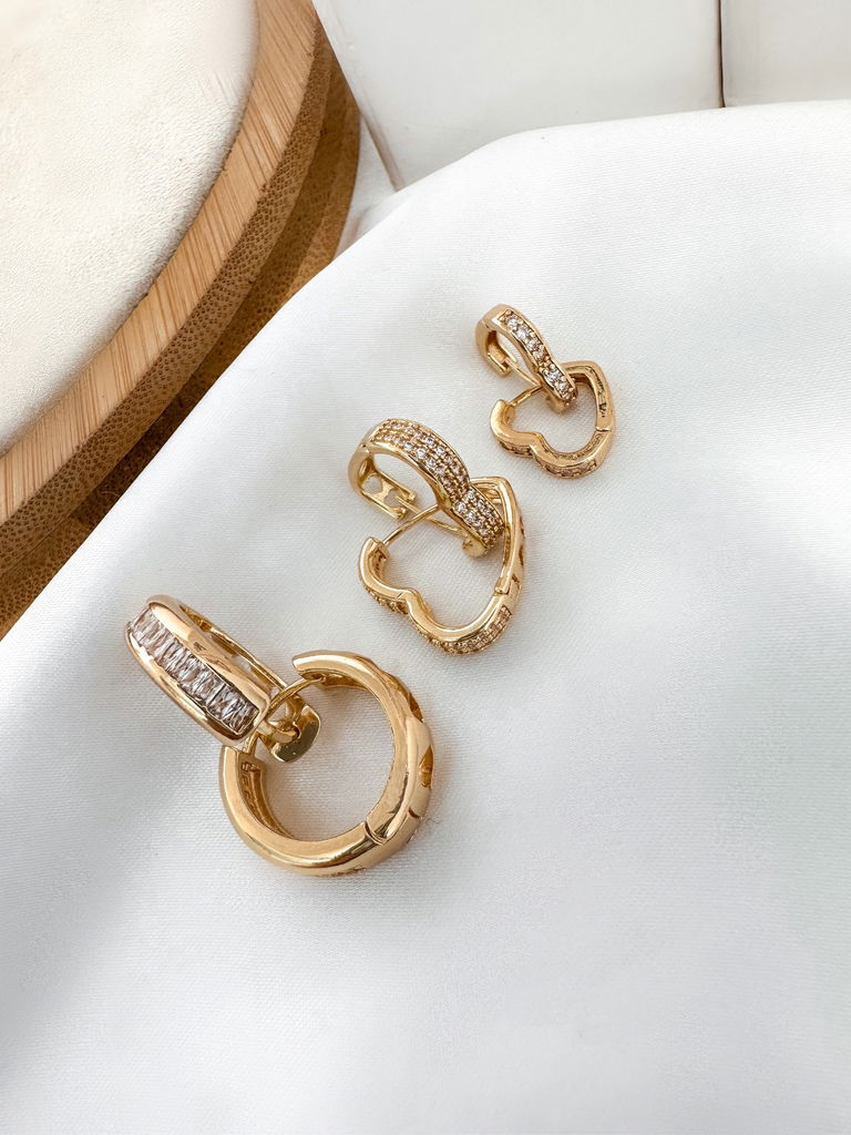 Trio de brincos cravados com navetes de zircônia e microzircônia folheado a ouro 18k e prata